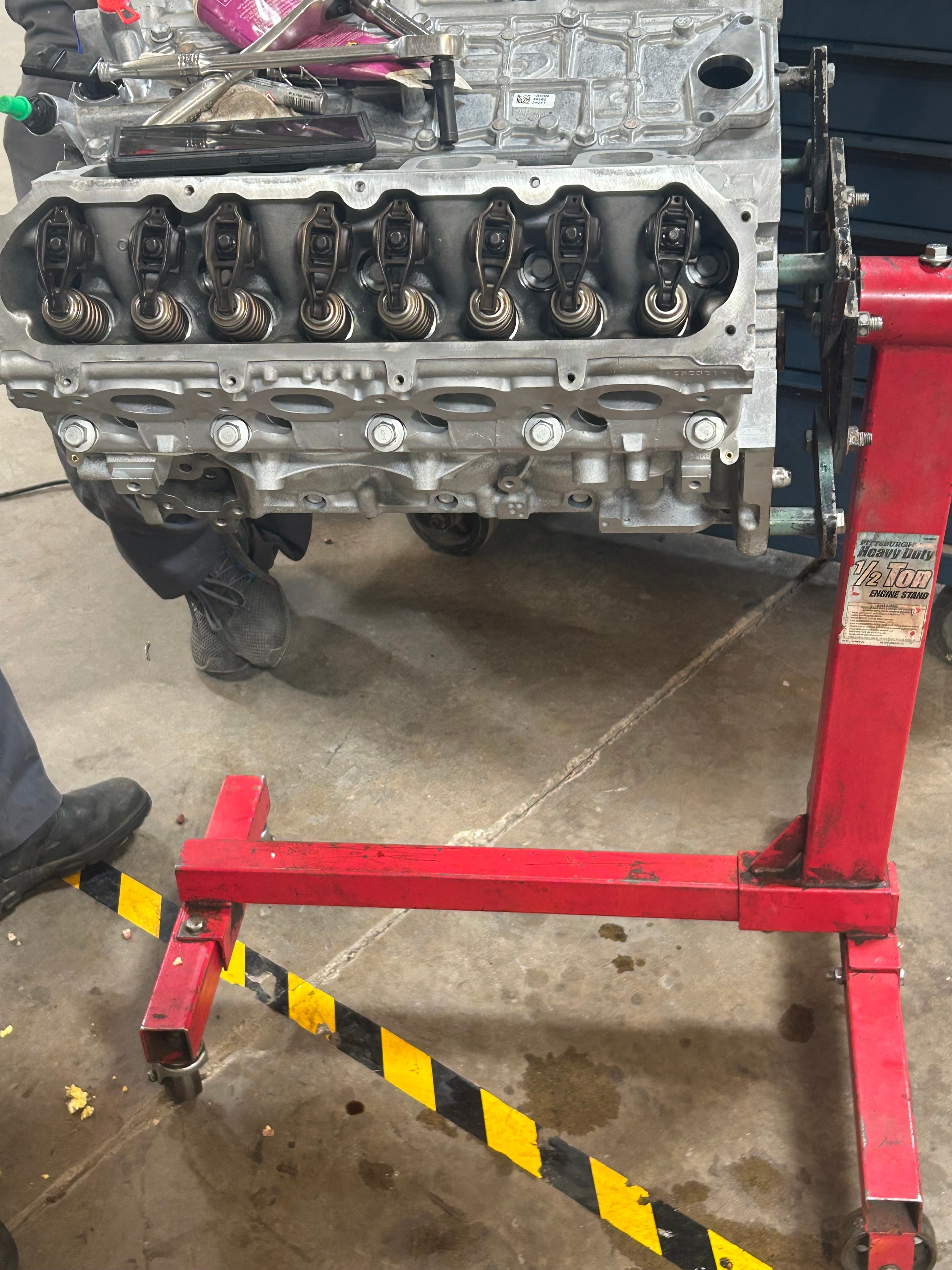 Engine block on a stand during a full rebuild at Five Star Engine Rebuilders